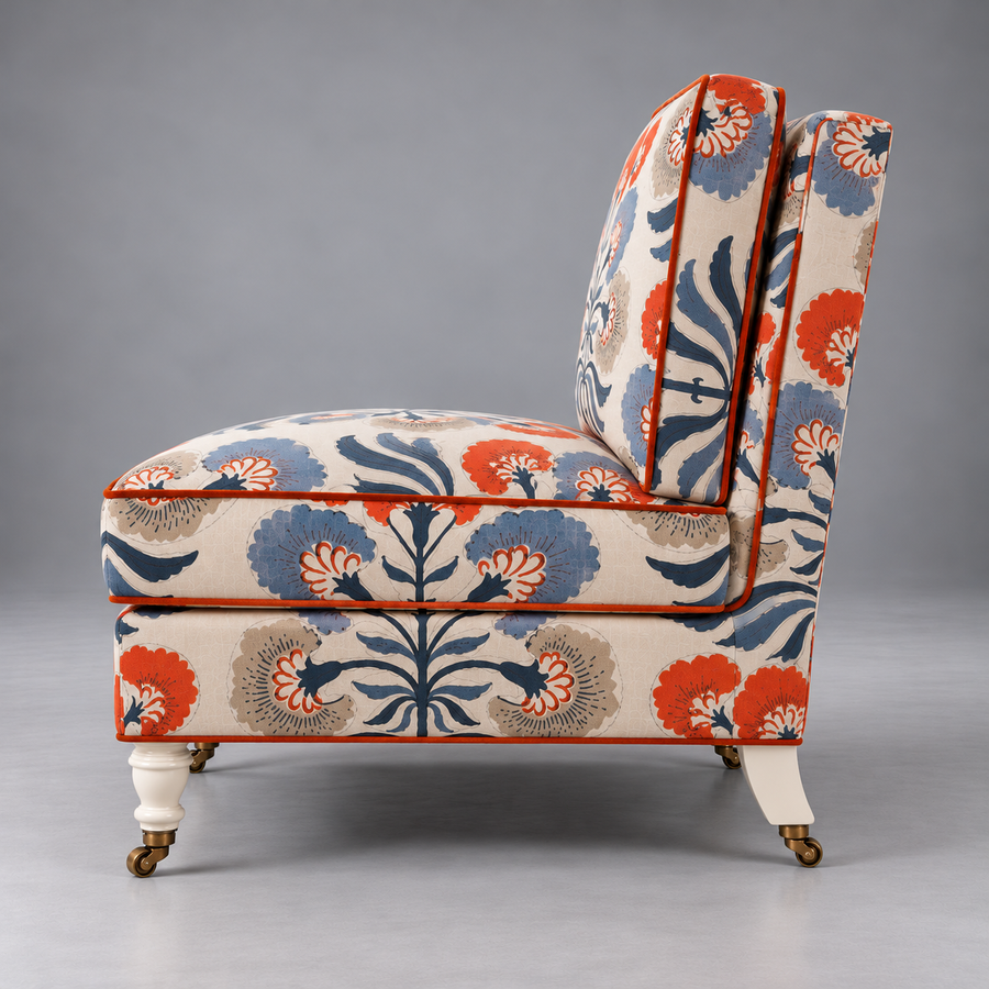 Gulmohar Slipper Chair – side profile showing brass castors